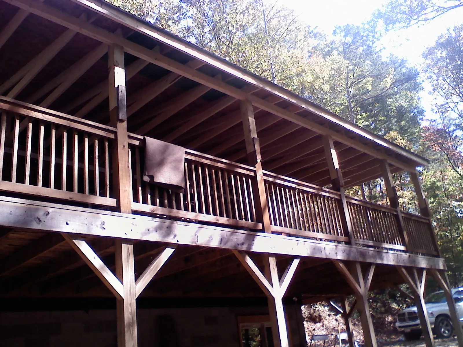 Timber framing under a new elevated porch and deck — Roof Leak Repair in White River Junction by Roofing Brothers